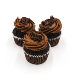 Chocolate cupcakes topped with chocolate frosting and chocolate curls